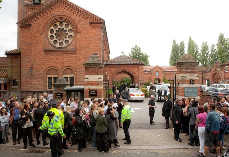 Members of the public gather opposite Golders Green Crematorium for the funeral ceremony of British singer Amy Winehouse, north London, Tuesday, July 26, 2011. Winehouse, who had battled alcohol and drug addiction, was found dead Saturday at her London home. She was 27. (AP Photo/Joel Ryan) *** Local Caption ***  Britain Amy Winehouse Funeral.JPEG-092a9.jpg