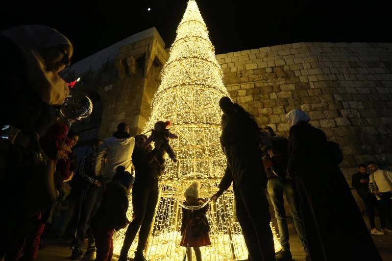 A Christmas tree is seen on the ornamented and lightened streets of the mostly Christian-populated Bab Touma neighborhood in the old city of Damascus, Syria. EPA