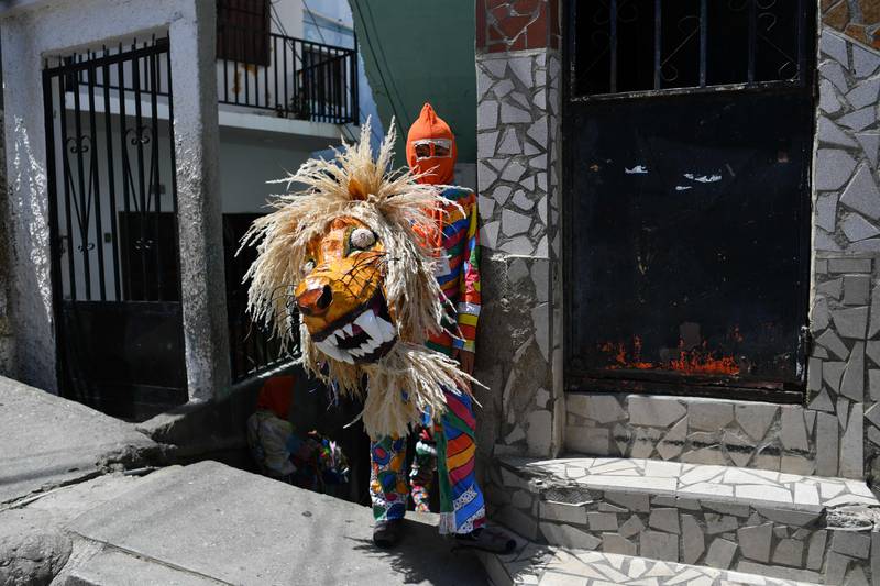 A member of the Dancing Devils group during the Catholic celebration of Corpus Christi, in Naiguata, Venezuela. AFP