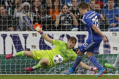 Schalke's Klaas-Jan Huntelaar scores past Real Madrid keeper Iker  Casillas to make it 2-1 on Tuesday night in their Champions League contest. Daniel Ochoa de Olza / AP