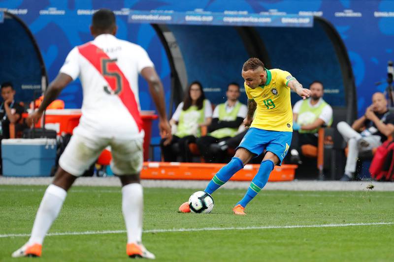 Everton Soares hits a shot to make it 3-0 to Brazil. EPA
