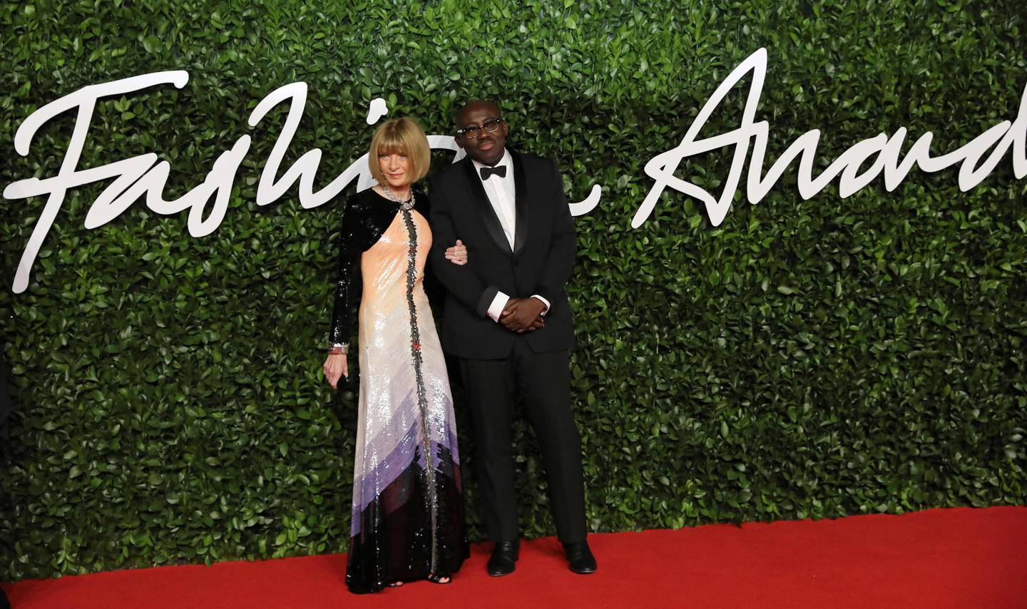 Vogue chief editor Anna Wintour (L) and British editor-in-chief of British Vogue magazine Edward Enninful  poses on the red carpet upon arrival at The Fashion Awards 2019 in London on December 2, 2019. The Fashion Awards are an annual celebration of creativity and innovation will shine a spotlight on exceptional individuals and influential businesses that have made significant contributions to the global fashion industry over the past twelve months. - RESTRICTED TO EDITORIAL USE -  NO MARKETING NO ADVERTISING CAMPAIGNS
 / AFP / ISABEL INFANTES / RESTRICTED TO EDITORIAL USE -  NO MARKETING NO ADVERTISING CAMPAIGNS
