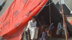 Temporary shelters help kids return to school in flood-hit Pakistan