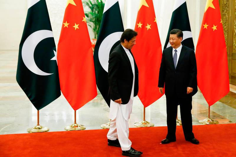 China's President Xi Jinping (R) meets with Pakistan's Prime Minister Imran Khan.  AFP