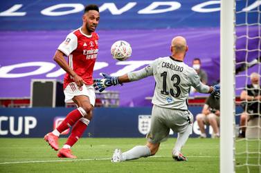 epa08579440 Arsenal's Pierre-Emerick Aubameyang (L) scores the 2-1 lead against Chelsea's goalkeeper Willy Caballero (R) during the English FA Cup final between Arsenal London and Chelsea FC at Wembley stadium in London, Britain, 01 August 2020. EPA/Adam Davy/NMC/Pool EDITORIAL USE ONLY. No use with unauthorized audio, video, data, fixture lists, club/league logos or 'live' services. Online in-match use limited to 120 images, no video emulation. No use in betting, games or single club/league/player publications.