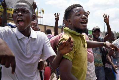 Supporters of spurned Congo opposition candidate Martin Fayulu react at the presidential elections results just before Fayuly arrived to address them in Kinshasha, Congo. Hundreds gathered to denounce what they called "the people's stolen victory" in the presidential election. AP