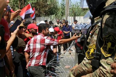 Iraqi demonstrators gather during an anti-government protest in front of the Governorate building in Basra, Iraq.  Reuters