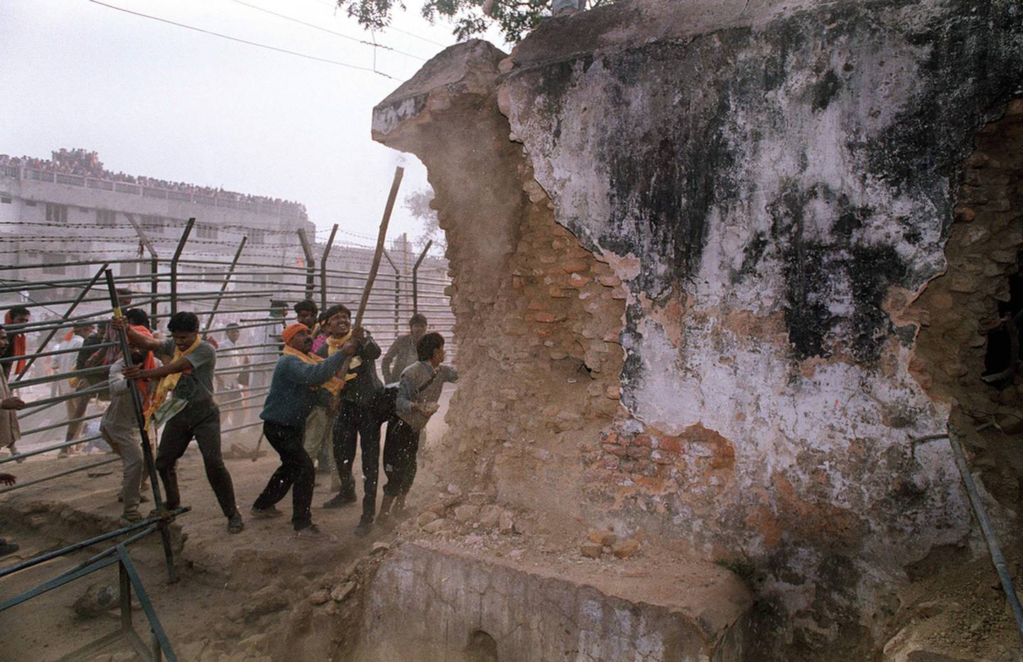 Indian Hindu fundamentalists attack the wall of the 16th century Babri mosque with iron rods at a disputed holy site in the city of Ayodhya in 1992.  AFP