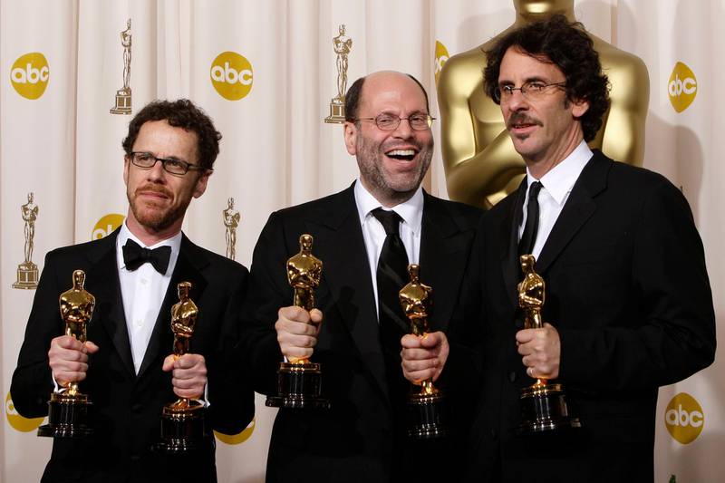 FILE - Writer-director Ethan Coen, from left, producer Scott Rudin and writer-director Joel Coen pose with their Oscars after the film "No Country for Old Men" won best motion picture of the year at the 80th Academy Awards in Los Angeles on Feb. 24, 2008. Rudin, one of the most successful and powerful producers, with a heap of Oscars and Tonys to show for it, has long been known for his torturous treatment of an ever-churning parade of assistants. Such behavior has long been engrained â€” and sometimes even celebrated â€” in show business. (AP Photo/Kevork Djansezian, File)