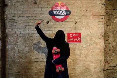 Nour Mohamed, 27, an Egyptian woman skateboarder wearing a full veil (niqab), takes a selfie with her board during the Red Bull Mind the Gap first skateboarding event in Egypt, inside Townhouse Gallery near Tahrir Square, amid the coronavirus disease (COVID-19) pandemic in Cairo, Egypt February 27, 2021. Picture taken February 27, 2021. REUTERS/Amr Abdallah Dalsh