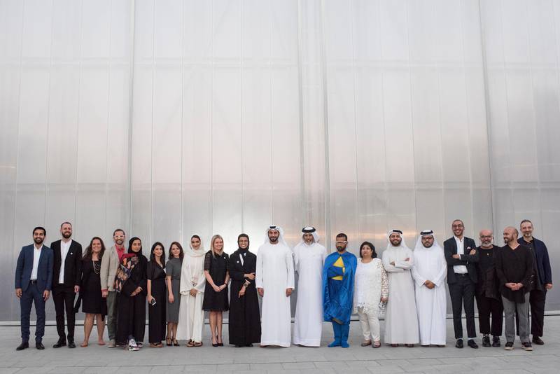 The artists, curators, and mentors of 'Ishara' pose with dignitaries at Concrete, Alserkal Avenue