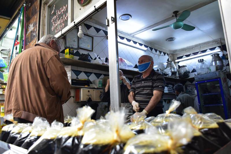 A Syrian vendor calls on people to buy liquorice, a famous Syrian juice which is considered one of rituals of Ramadan, in one of the old souks of Damascus, Syria.  EPA