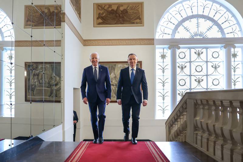 Mr Biden is welcomed by Mr Duda at the Presidential Palace in Warsaw. Reuters
