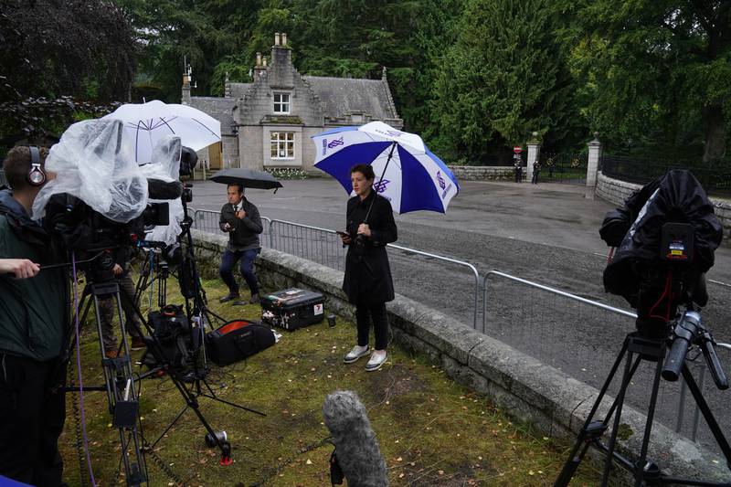 Media gather outside Balmoral Castle in Scotland, where the UK's Queen Elizabeth II is under medical supervision. PA