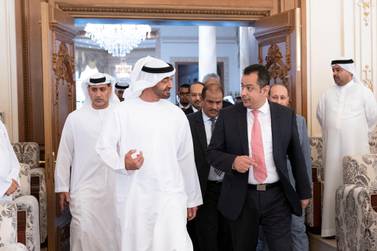 ABU DHABI, UNITED ARAB EMIRATES - June 10, 2019: HH Sheikh Mohamed bin Zayed Al Nahyan, Crown Prince of Abu Dhabi and Deputy Supreme Commander of the UAE Armed Forces (L) receives HE Dr Maeen Abdulmalik, Prime Minister of Yemen (R), during a Sea Palace barza. ( Mohamed Al Hammadi / Ministry of Presidential Affairs ) ---
