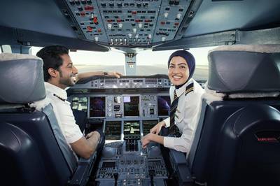 One of Emirate Airline's youngest pilots, Bakhita Al Muhairi, 23, an Emirati, is pictured in the cockpit alongside a colleague.