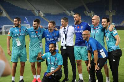 Al Hilal manager Razvan Lucescu and coaching staff celebrate.