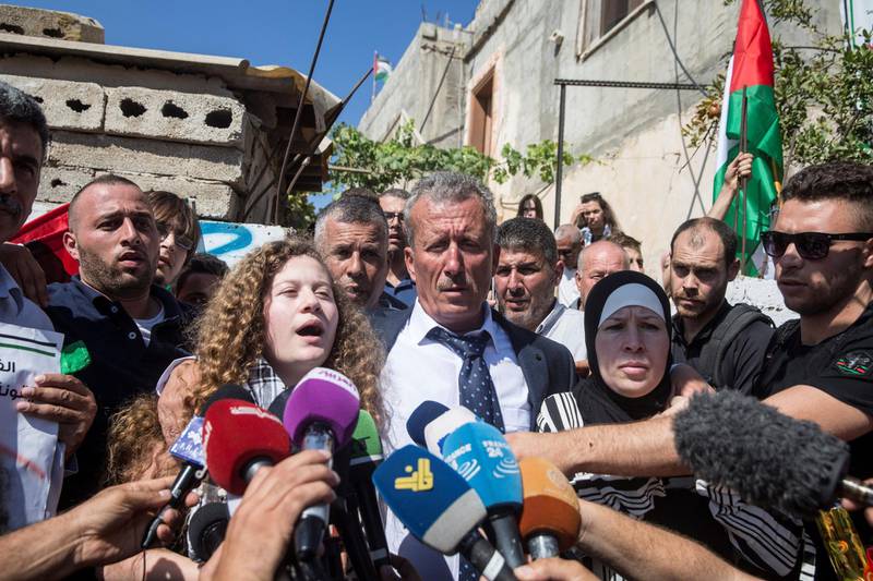 17-year-old Palestinian, who was arrested 8 months ago and entered prison in March after she was recorded physically assaulting an Israeli soldier, as speaks to the media with her father and mother  after  she arrived to  her village Nabi Salah after being released earlier this morning from the  Sharon prison.Her mother, who was also arrested for filming and posting the incident, is also released.She thanked everyone for their support.(Photo by Heidi Levine For The National).