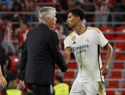Real Madrid manager Carlo Ancelotti shakes hands with Jude Bellingham after the match. Reuters
