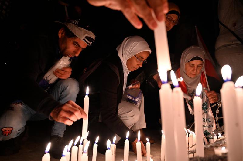 Anti-government protesters light candles after protester Ahmad Tawfik dies in Martyrs' Square in Beirut.  EPA