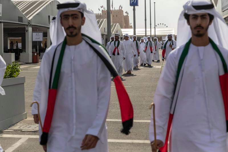 Emiratis prepare for the UAE Union Parade at the festival.



