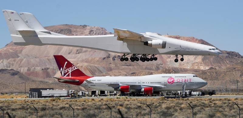 The Stratolaunch plane, the world's largest aircraft, comes in to land over Virgin Orbit 747 Cosmic Girl after it performed a second test flight in Mojave, California, USA. Reuters