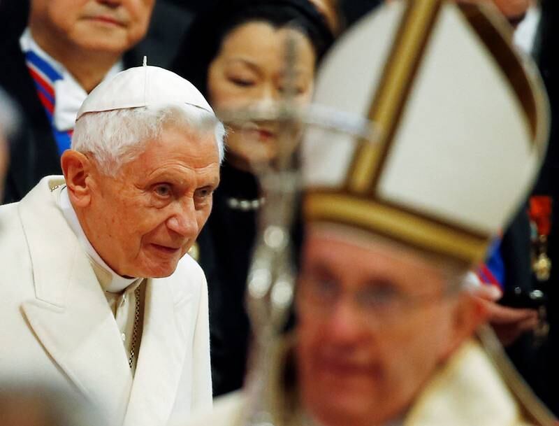 Emeritus Pope Benedict, left,  as Pope Francis arrives to lead a mass to create 20 new cardinals, February 14, 2015.  Reuters