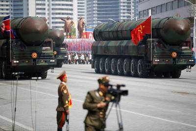 Intercontinental ballistic missiles (ICBM) driving past the stand with North Korean leader Kim Jong-un and other high ranking officials during a military parade marking the 105th birth anniversary of country's founding father Kim Il-sung, in Pyongyang on April 15, 2017. The missiles themselves were shown for the first time inside a new kind of canister-based launcher on Saturday. Damir Sagolj / Reuters