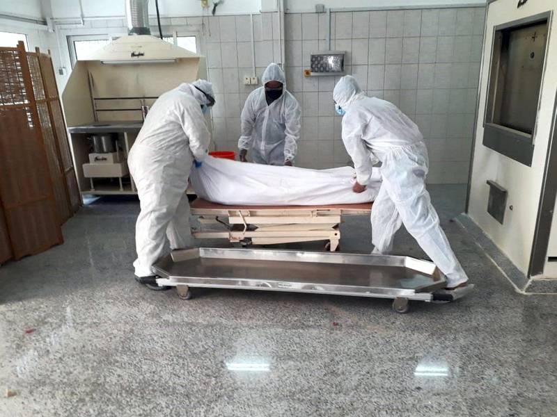 Attendants at the crematorium in Dubai wear protective gear when handling people who have died due to Covid-19. Dignity and safety are observed as bodies are taken directly from the ambulance to the incinerator inside the Jebel Ali crematorium in line with regulations. Courtesy: New Sonapur Hindu Cremation Ground