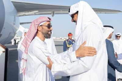 Sheikh Tahnoun bin Zayed, National Security Adviser and Deputy Ruler of Abu Dhabi, speaks to Sheikh Tamim on arrival in Doha
