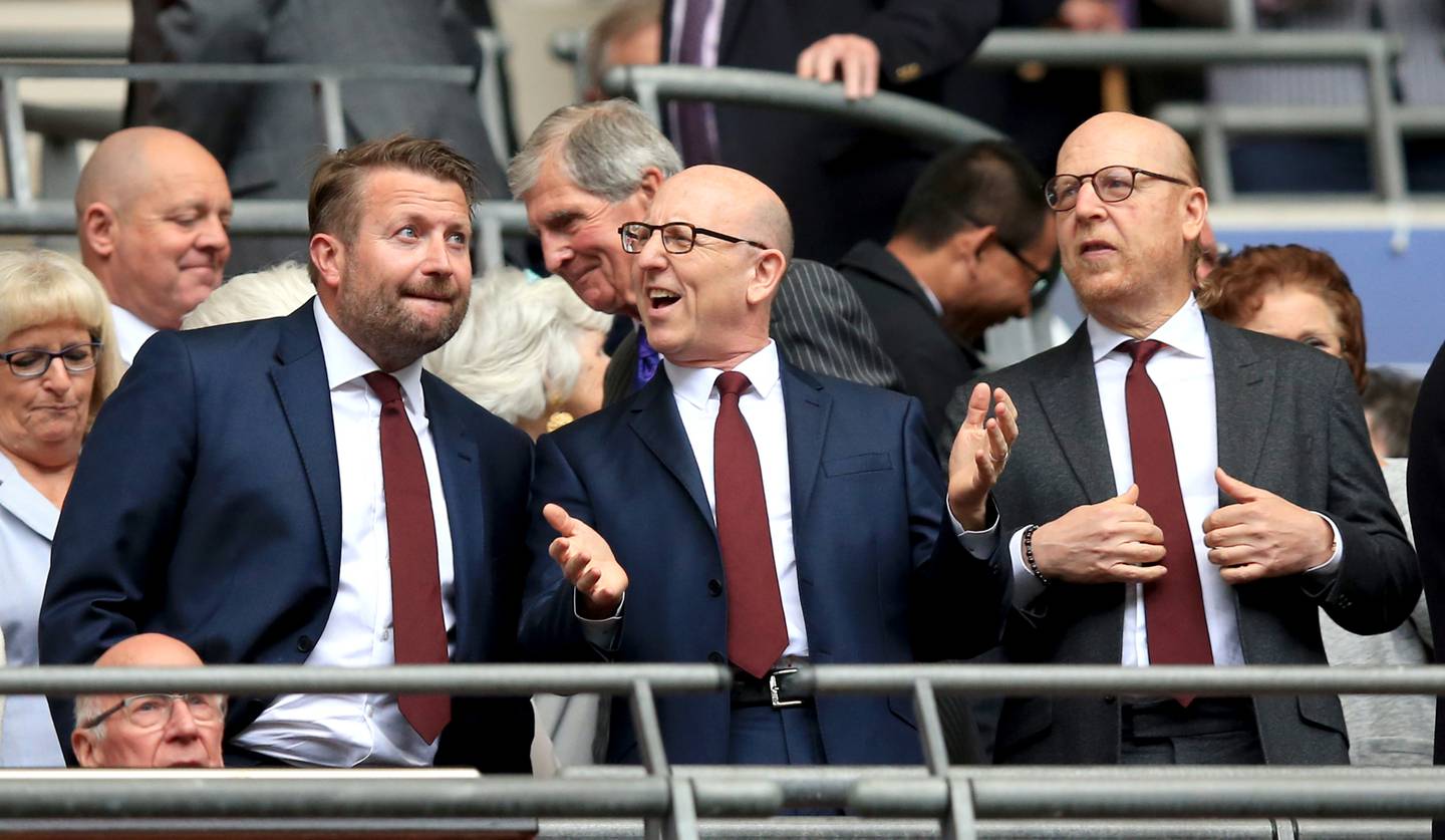 Manchester United group commercial director Richard Arnold, left, with joint chairmen Joel Glazer and Avram Glazer. PA