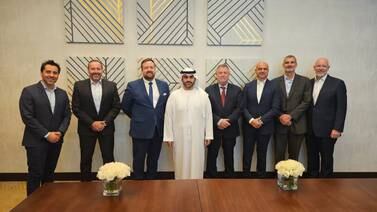 Martin Reynolds, third left, has brought Sheikh Ahmed bin Mana, centre, on board for his green tech venture in Abu Dhabi. Photo: Zero Carbon Ventures