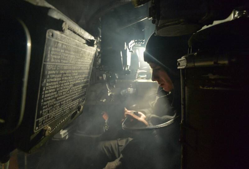 A member of the Armed Forces of Ukraine inside an armoured personnel carrier near the line of separation from Russian-backed rebels in the Donetsk region, Ukraine. Reuters