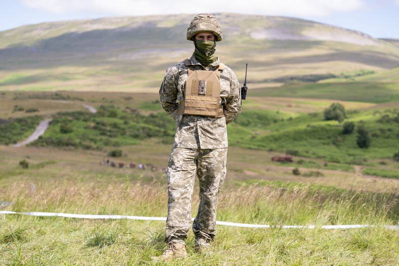 A new recruit poses for a picture during training at a base near Manchester. PA