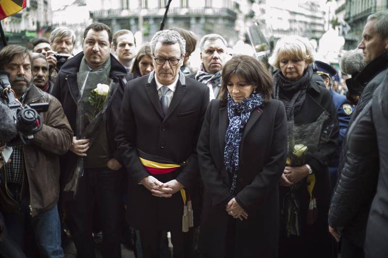 The mayor of Brussels, Yvan Mayeur (centre left) and mayor of Paris, Ann Hidalgo (centre right) pay tribute on March 23, 2016, at Place de la Bourse, Brussels, Belgium, to the victims of the terrorist attacks. Yoan Valat / EPA