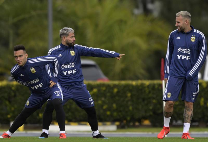 Argentina players Lautaro Martinez, Sergio Aguero and Nicolas Otamendi take part in a training session. AFP
