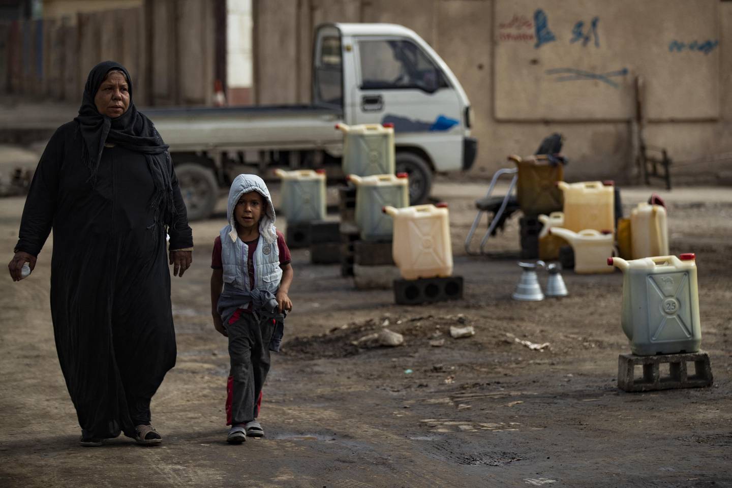 A Syrian woman and child in Raqqa. The country registered the most landmine blasts in the world last year. AFP