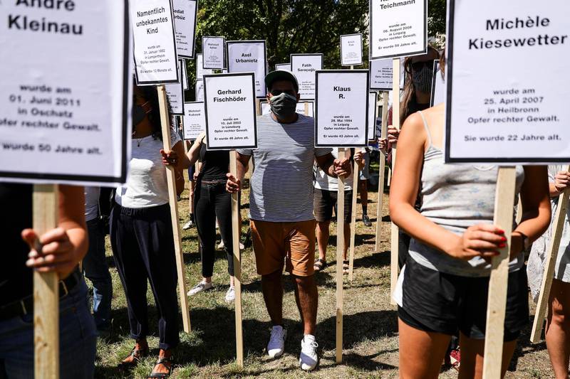 epa08558356 Protesters hold banners with the names of some 220 murdered victims of right-wing terror acts in Germany, as part of a remembrance vigil for the victims of the Halle terror attack, outside the regional court in Magdeburg, Saxony-Anhalt, Germany, 21 July 2020. The suspect, a 27-year-old German neo-Nazi named by the media as Stephan Balliet, went on rampage shooting and killed two people on 09 October 2019 in front of the synagogue and a Kebab shop in Halle during the celebrations on the Jewish holiday of Yom Kippur.  EPA/OMER MESSINGER