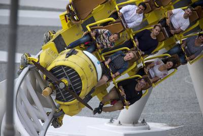 Visitors on Flying Aces, the new roller coaster at Ferrari World, during its official opening on Wednesday. Christopher Pike / The National
