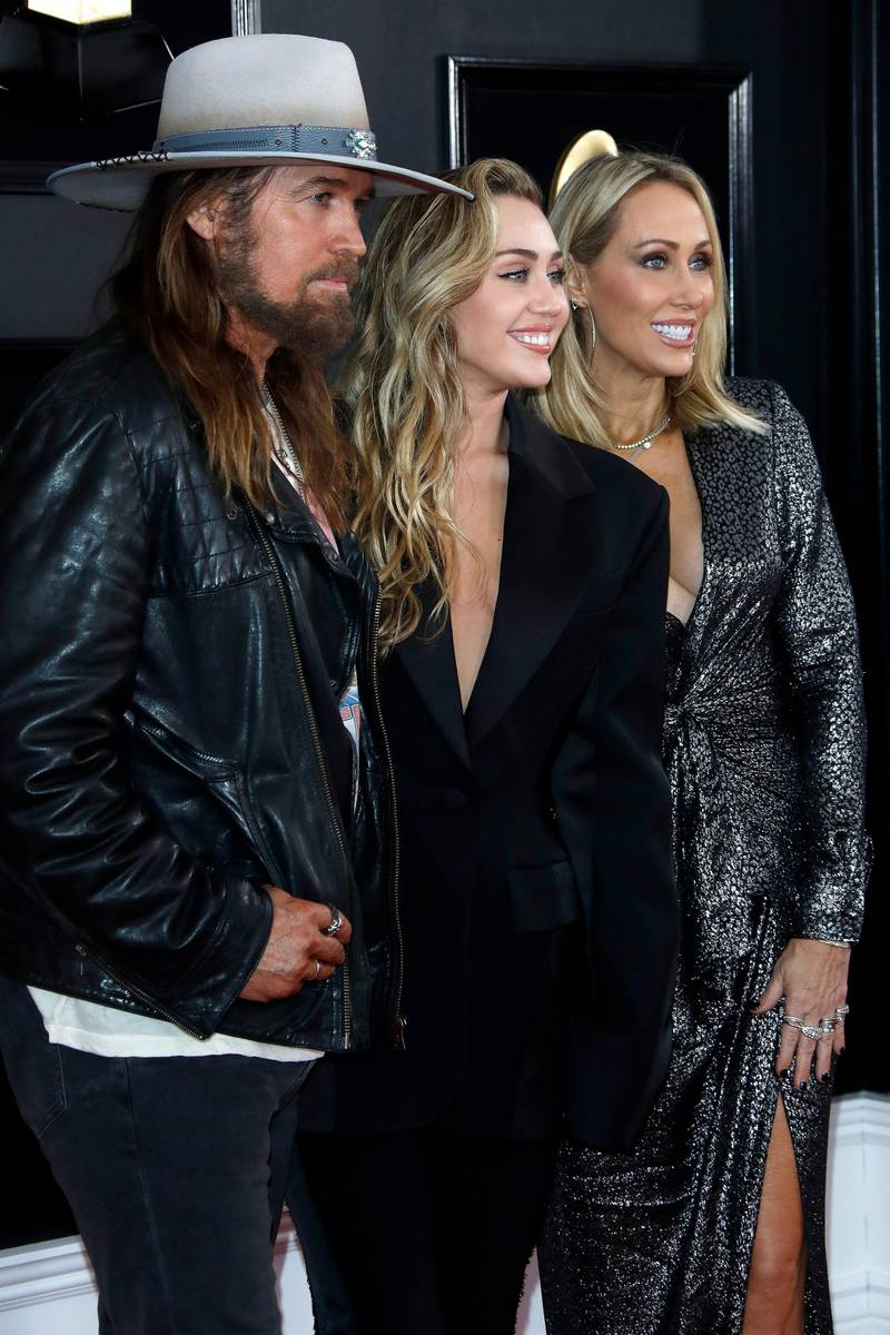 epa07361261 (L-R) Billy Ray Cyrus, Miley Cyrus and Tish Cyrus arrive for the 61st annual Grammy Awards ceremony at the Staples Center in Los Angeles, California, USA, 10 February 2019.  EPA-EFE/NINA PROMMER