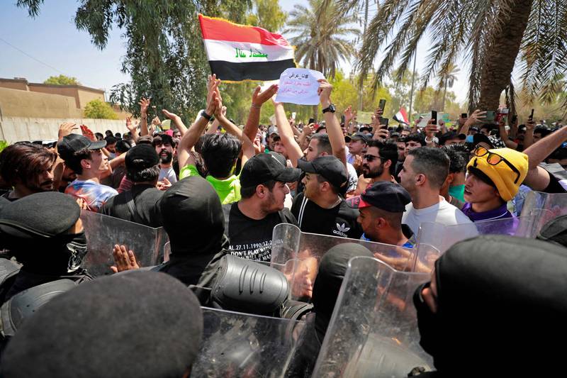 Iraqis chant slogans demanding the expulsion of the Turkish ambassador outside the Turkish visa office in Baghdad, during a demonstration following the attack. AFP