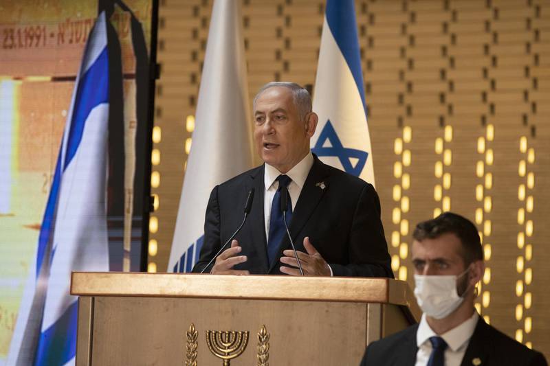 FILE - In this Wednesday, April 14, 2021 file photo, Israeli Prime Minister Benjamin Netanyahu speaks at a Memorial Day ceremony at the military cemetery at Mount Herzl, Jerusalem. Netanyahu faces a midnight deadline on Tuesday, May 4, to put together a new coalition government. If he fails, he faces the possibility of leading his Likud party into the opposition for the first time in 12 years. (AP Photo/Maya Alleruzzo, Pool, File)