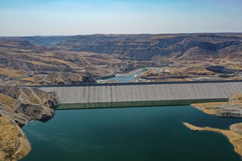 MARDIN, TURKEY - OCTOBER 02: Turkey's fourth biggest dam of Ilisu is seen filling its reservoir on October 02, 2019 in Mardin, Turkey.  The ancient Silk Road trading post of Hasankeyf, which sits on the banks of Tigris River in southeast Turkey, will soon be flooded by the Ilisu Dam. Hasankeyf is thought to be one of the oldest continuously inhabited settlements on Earth, dating as far back as 12,000 years. It will be completely submerged when a reservoir behind the new Ilisu Dam causes the river to rise some 60 meters in a few months. Ilisu is the fourth biggest dam in Turkey and is a key part of Turkeys Southeastern Anatolia Project (GAP), designed to improve its poorest and least developed region. In 2006 the Turkish government officially began work on the giant dam across the Tigris River, which will lead to the submerging of an estimated 80 percent of Hasankeyf and the displacement of its 3,000 residents, as well as many other people. The Ilisu dam and the Hydra Electric Power Plant will help fulfil the country's energy needs and provide irrigation to the agricultural lands surrounding it. Once activated, the power plant will generate 3,800 gigawatts hours of electricity annually. The project will affect 199 settlements in the area and push thousands of people out of their homes and away from their livelihoods. The government has built a new town with 710 houses for the Hasankeyf residents 3 kilometers away from the ancient town. Eight monuments have also been relocated to safer ground near the new settlement but the rest of the city, with all its rich history, will be inundated. Only the citadel will still be visible above the water. The Turkish government has given residents until 8 October to evacuate.  (Photo by Burak Kara/Getty Images)
