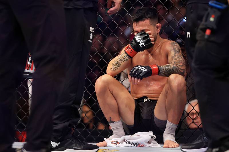 LAS VEGAS, NEVADA - JULY 02: Pedro Munhoz of Brazil reacts after an unintentional eye poke from Sean O'Malley in their bantamweight bout during UFC 276 at T-Mobile Arena on July 02, 2022 in Las Vegas, Nevada.  The fight was ruled a no contest.    Carmen Mandato / Getty Images / AFP
