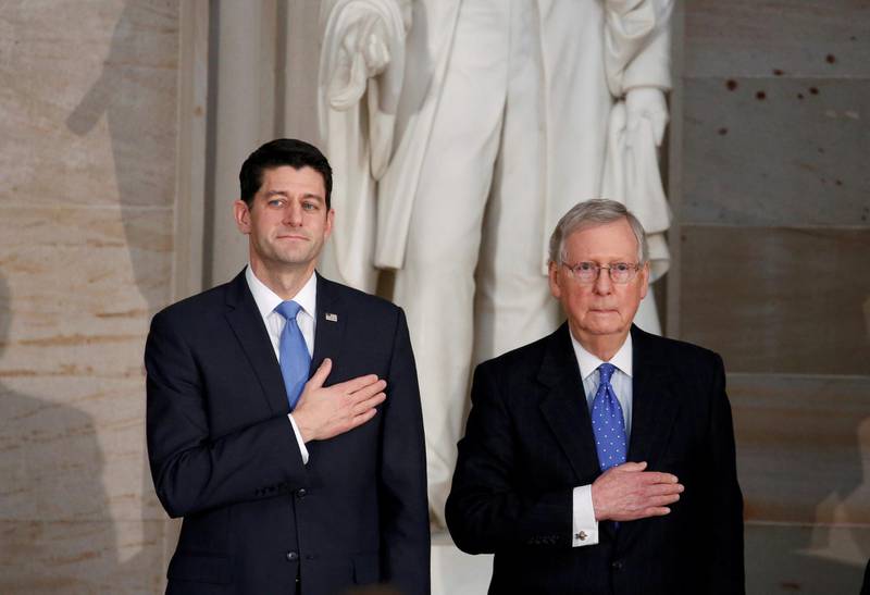 FILE PHOTO: Speaker of the U.S. House Paul Ryan (R-WI) and Senate Majority Leader Mitch McConnell (R-KY) stand during a Congressional Gold Medal ceremony honoring former Senate majority leader Bob Dole (R-KS) on Capitol Hill in Washington, DC, U.S., January 17, 2018.      REUTERS/Joshua Roberts/File Photo