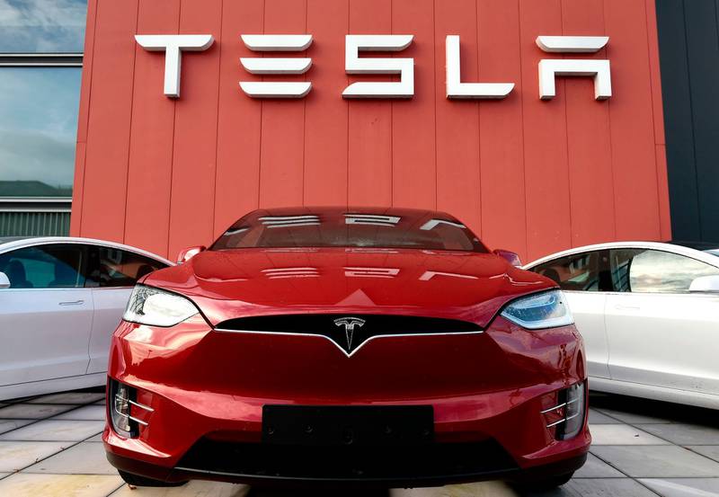 (FILES) In this file photo taken on October 23, 2019 cars and a logo are pictured at the showroom and service center for the US automotive and energy company Tesla in Amsterdam. Tesla CEO Elon Musk announced on November 12, 2019 in Berlin the construction of a new "gigafactory" in the outskirts of the German Capital city. / AFP / John THYS
