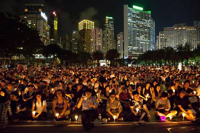 People take part in a candlelight vigil in Hong Kong on June 4, 2015, to mark the crackdown on the pro-democracy movement in Beijing’s Tiananmen Square in 1989. Tens of thousands were expected to mark the 26th anniversary of the Tiananmen Square crackdown, organisers said. Dale de la Rey/AFP Photo