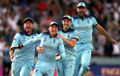 England's Jos Buttler, second left, celebrates with teammates after running out New Zealand batsman Martin Guptill to win the World Cup final on July 1, 2019. AP