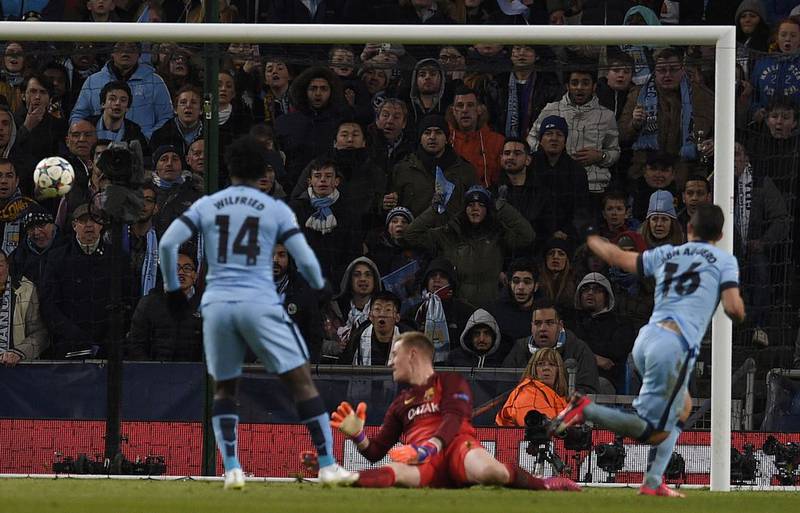 Manchester City's Sergio Aguero scores his team's lone goal in their 2-1 loss to Barcelona on Tuesday night in the Champions League last 16 first leg match. Lluis Gene / AFP