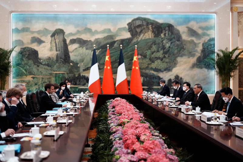 Chinese Premier Li Qiang and French President Emmanuel Macron at a meeting at the Great Hall of the People. AFP